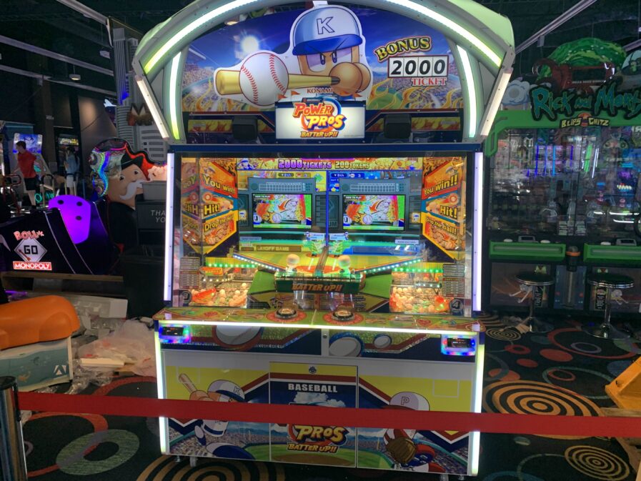 A new English-language Power Pros arcade game A photo of a coin pusher arcade machine called Power Pros Batter Up